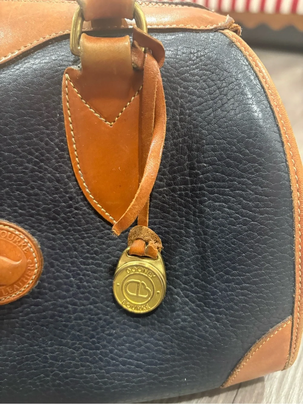 Dooney & Bourke Navy and Tan Pebbled Leather Doctor Bag